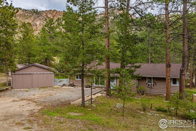 exterior space with an outbuilding and a mountain view