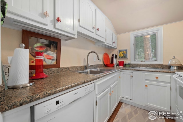 kitchen with white cabinetry, sink, and white dishwasher