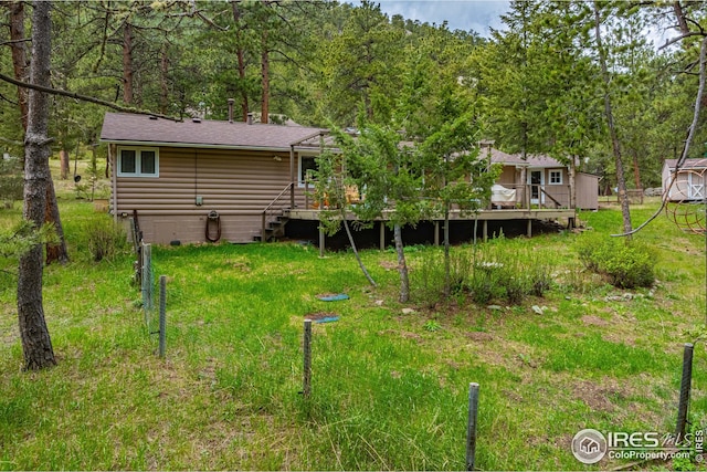 view of yard featuring a wooden deck