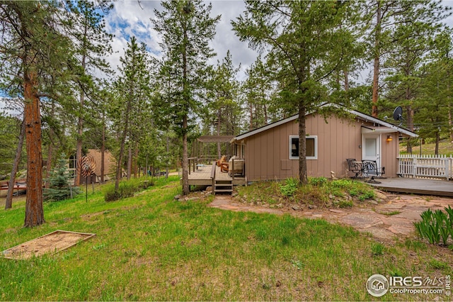 view of yard featuring a wooden deck