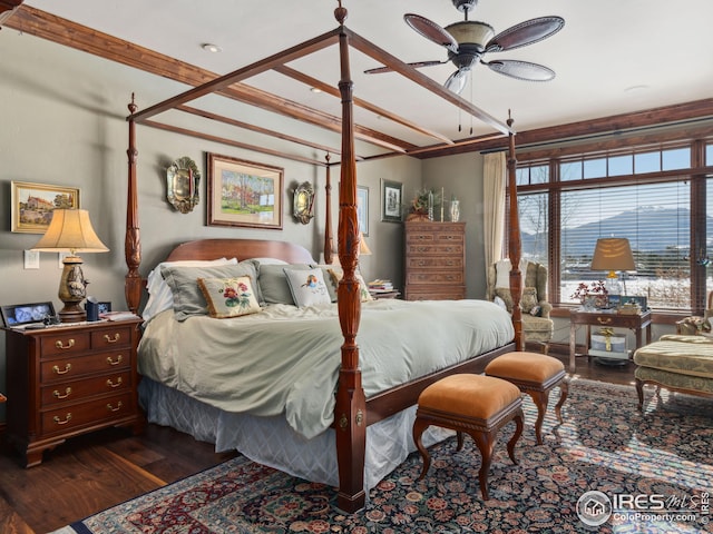 bedroom with dark hardwood / wood-style floors