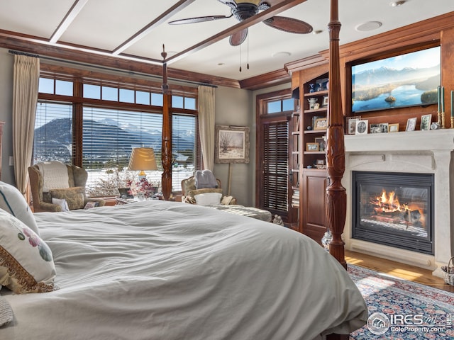 bedroom with a mountain view and hardwood / wood-style floors