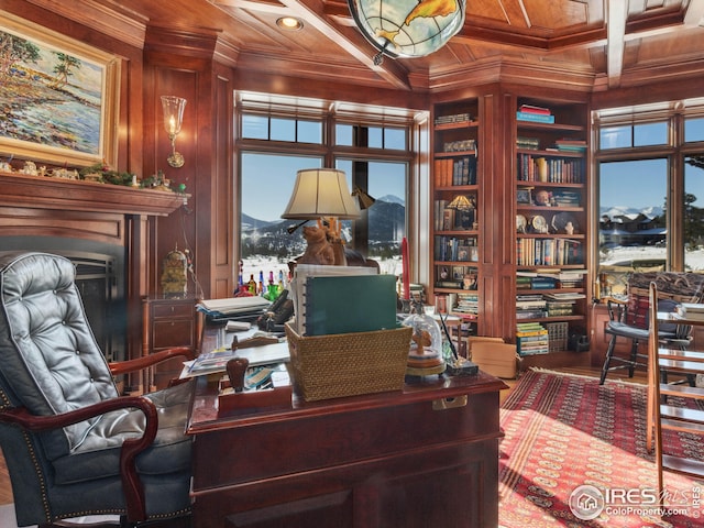 office space with wood ceiling, crown molding, wooden walls, coffered ceiling, and a fireplace