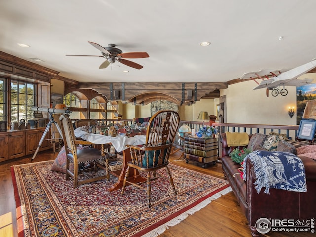 dining room with hardwood / wood-style flooring and ceiling fan