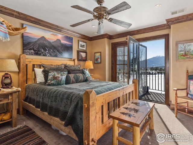 bedroom featuring ornamental molding, a mountain view, access to exterior, and ceiling fan