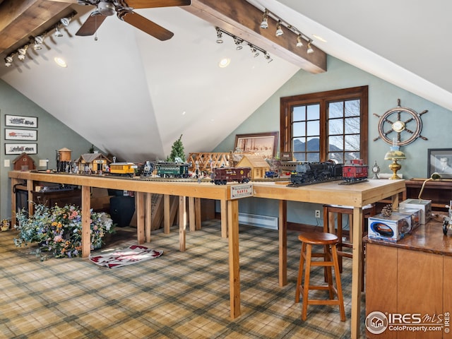 interior space with baseboard heating, ceiling fan, and lofted ceiling