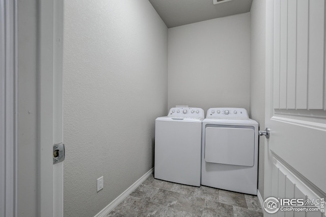 laundry area with independent washer and dryer