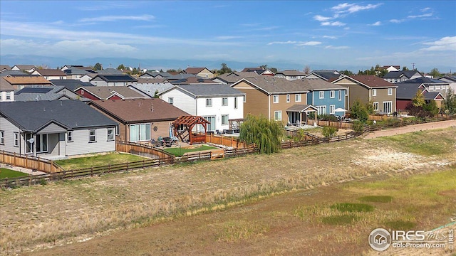 view of front of property featuring a fenced backyard and a residential view