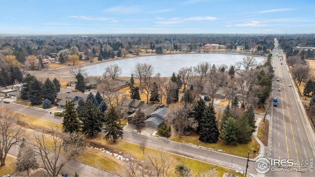 drone / aerial view with a residential view and a water view