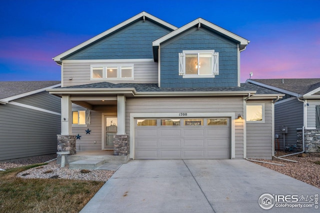 craftsman house with a garage and covered porch