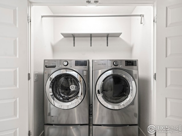 clothes washing area featuring washing machine and clothes dryer