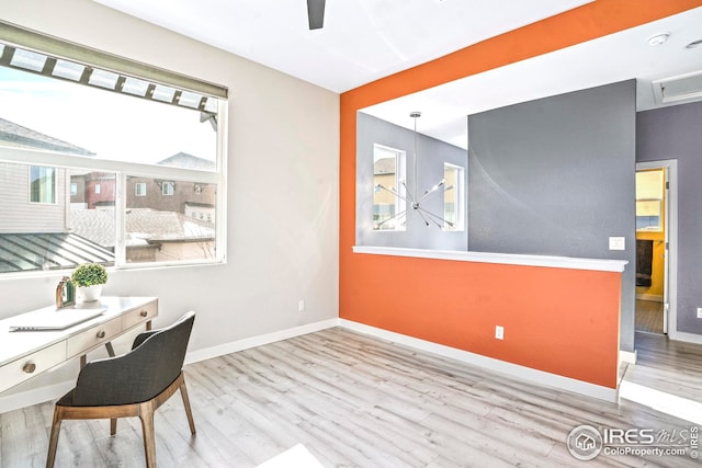 office with light hardwood / wood-style flooring
