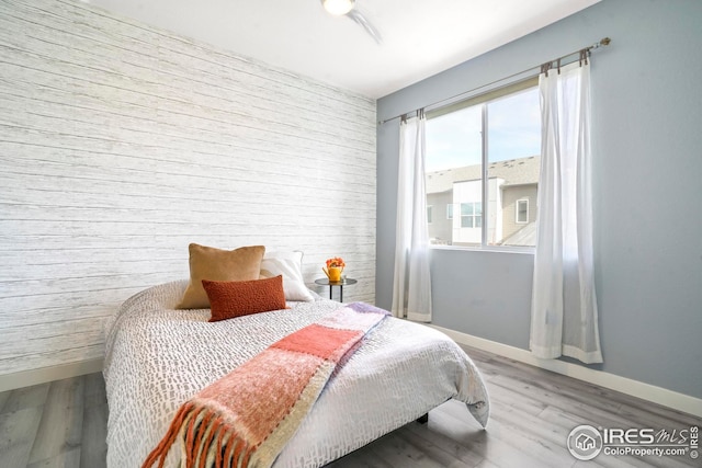 bedroom with light wood-type flooring