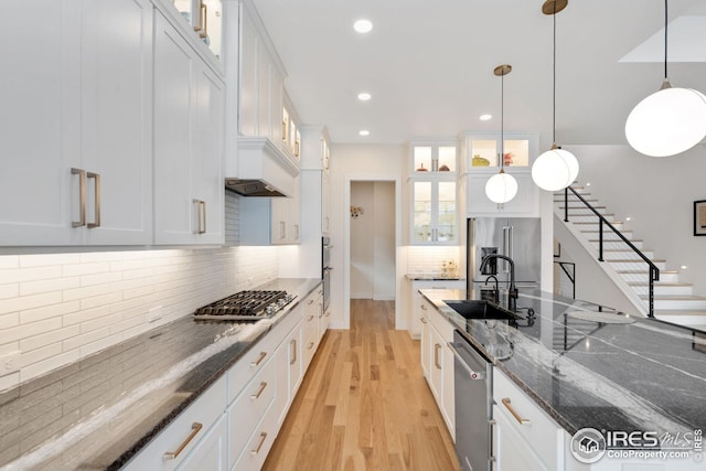 kitchen featuring glass insert cabinets and white cabinetry