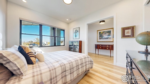 bedroom featuring recessed lighting and light wood-style flooring