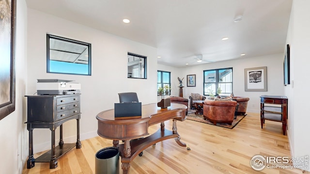 home office with baseboards, light wood-type flooring, a ceiling fan, and recessed lighting