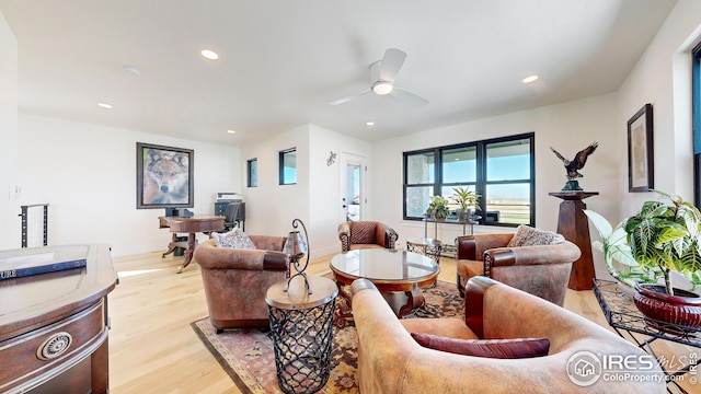 living area featuring recessed lighting, a ceiling fan, and light wood-style floors