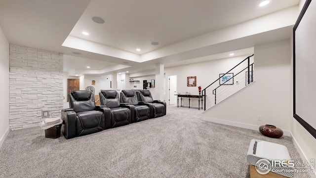 carpeted cinema room featuring baseboards, a raised ceiling, and recessed lighting