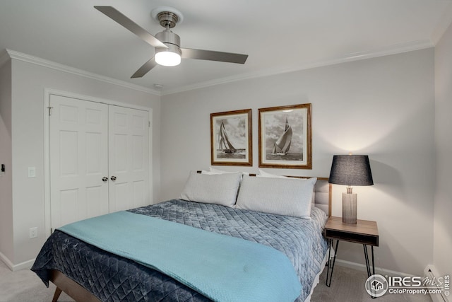 carpeted bedroom with ceiling fan, ornamental molding, and a closet