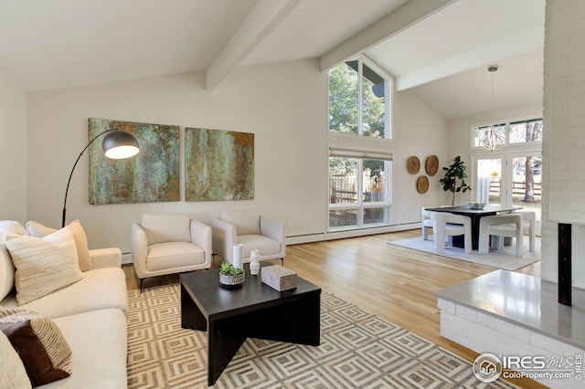 living room with beam ceiling, light hardwood / wood-style floors, french doors, and baseboard heating