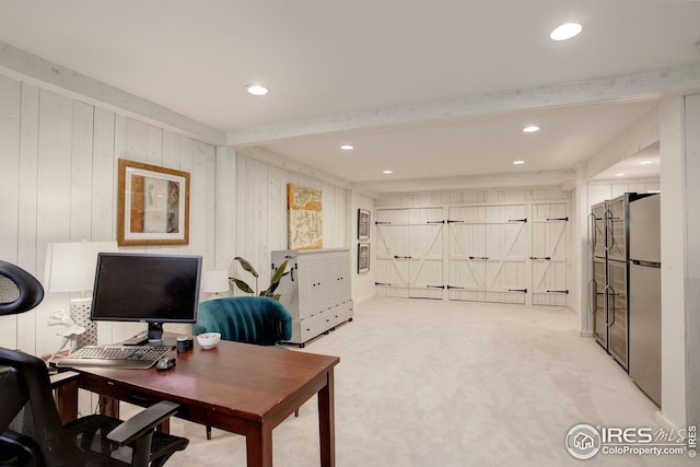 carpeted office with beam ceiling