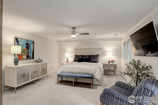 carpeted bedroom featuring ornamental molding and ceiling fan