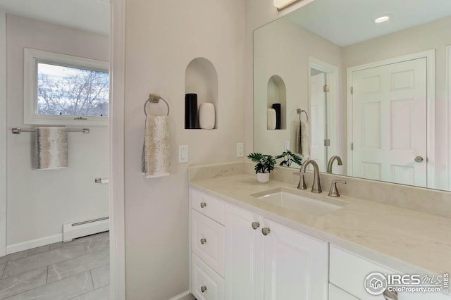 bathroom featuring vanity and a baseboard radiator