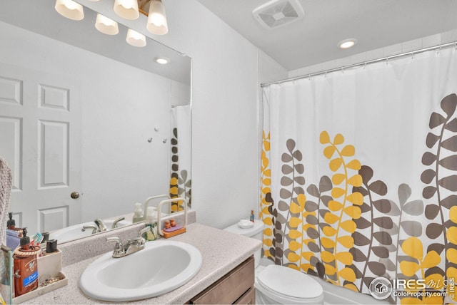 bathroom with a shower with shower curtain, visible vents, toilet, and vanity