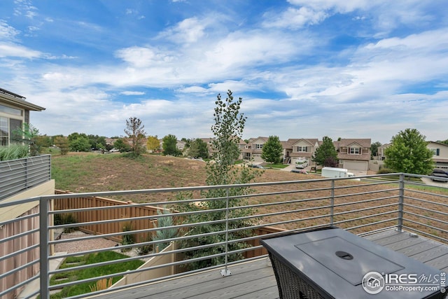 wooden terrace with a residential view