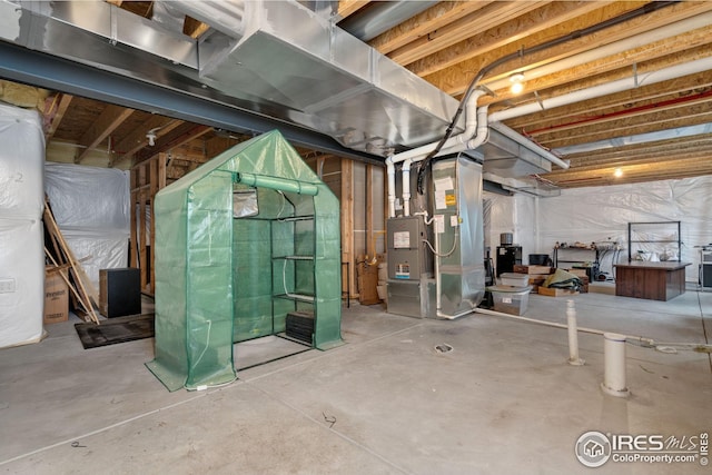 basement featuring heating unit