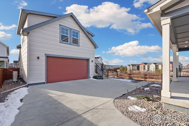 view of side of property featuring a garage