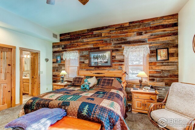 420 E County Road 10, Berthoud, CO 80513 - bedroom featuring multiple windows, visible vents, wood walls, and carpet floors