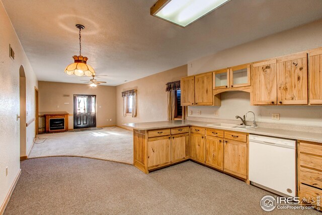 420 E County Road 10, Berthoud, CO 80513 - kitchen featuring light countertops, a peninsula, a sink, white dishwasher, and light colored carpet
