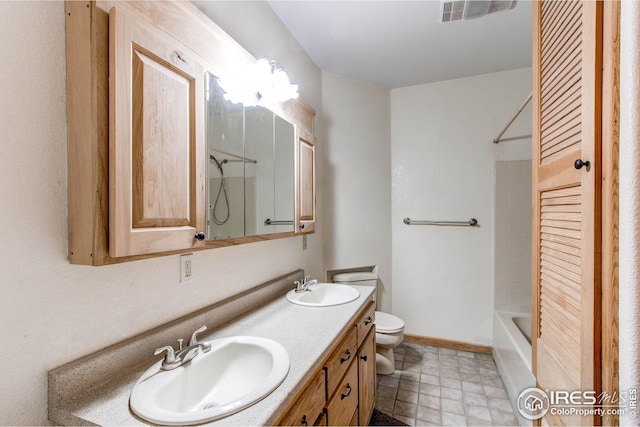 420 E County Road 10, Berthoud, CO 80513 - bathroom featuring double vanity, visible vents, toilet, and a sink