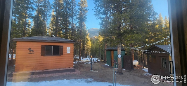 view of property exterior featuring a shed