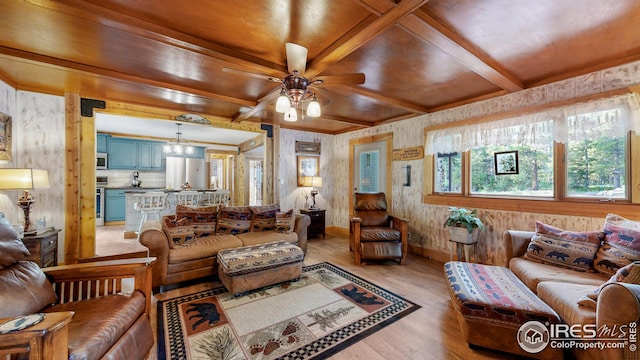 living room featuring ceiling fan, beam ceiling, and light wood-type flooring