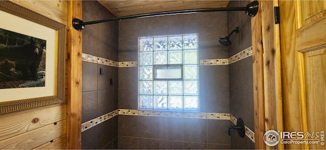 bathroom with a tile shower