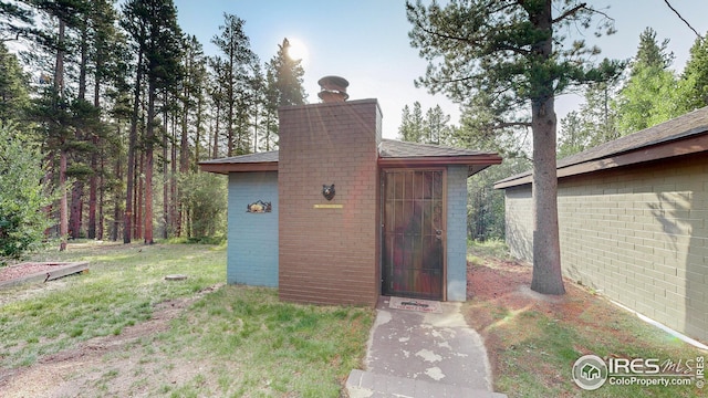 view of outdoor structure with a lawn