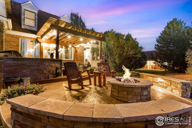 patio terrace at dusk with an outdoor fire pit