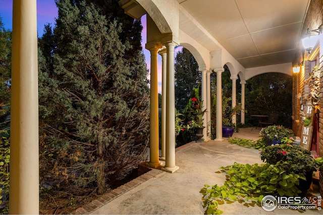 view of patio terrace at dusk