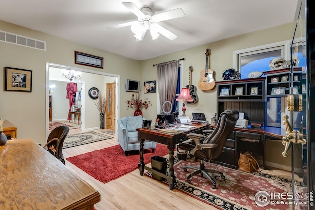 office with wood-type flooring and ceiling fan