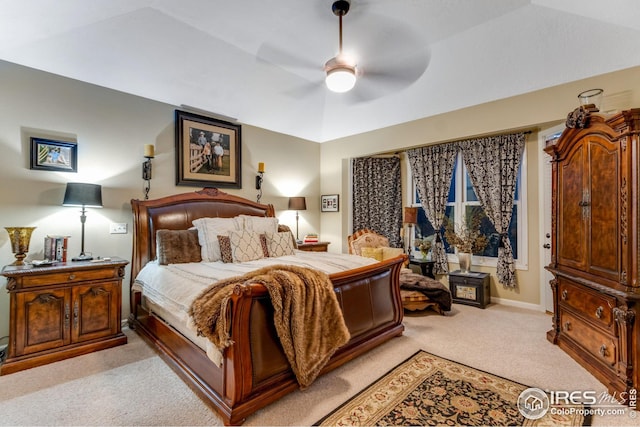 bedroom featuring ceiling fan and light colored carpet