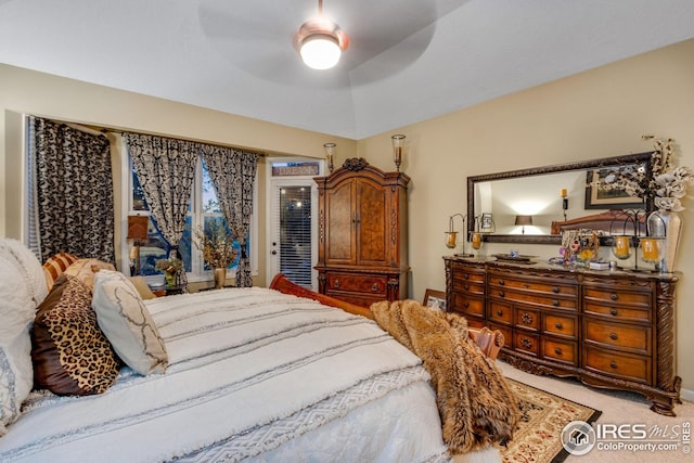 carpeted bedroom featuring access to outside and ceiling fan