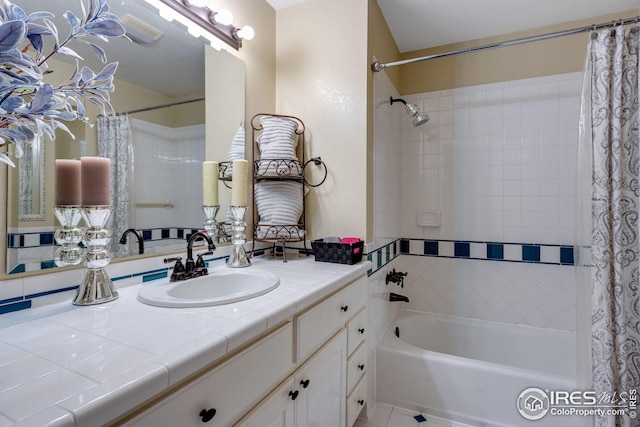 bathroom with vanity, tile patterned floors, and shower / bath combo