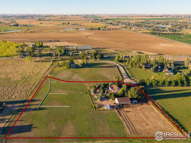 birds eye view of property featuring a rural view