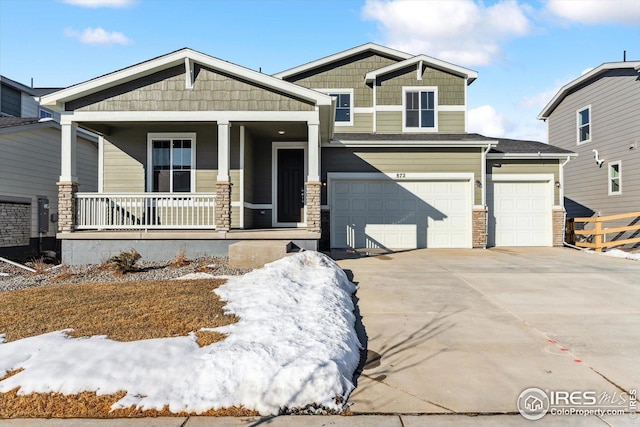 craftsman-style home featuring a garage and covered porch