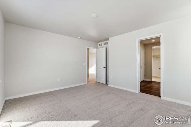 unfurnished bedroom with carpet floors