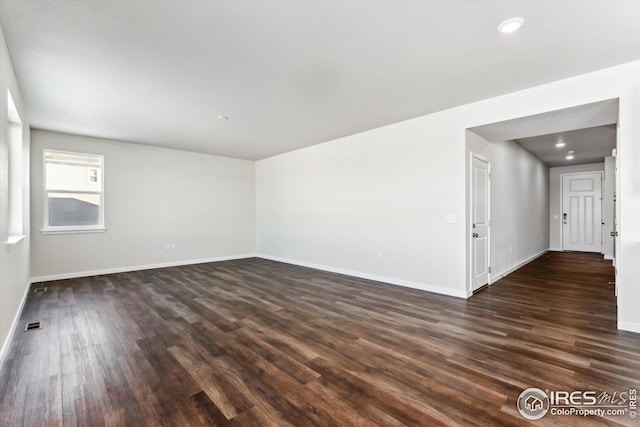 empty room featuring dark hardwood / wood-style floors