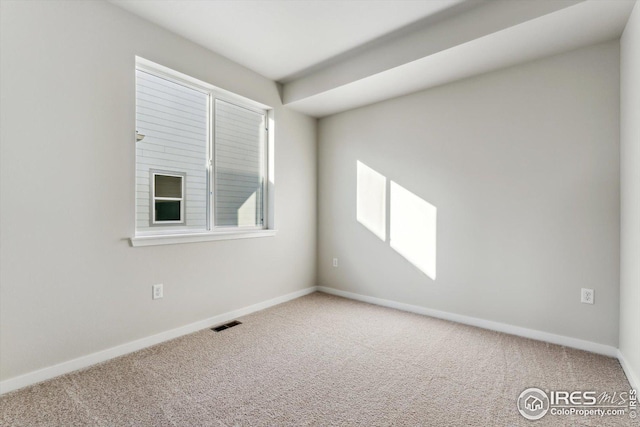 unfurnished room featuring carpet flooring