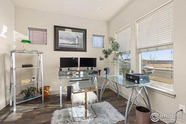 home office with dark wood-type flooring